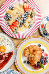A composition of vintage plates featuring breakfast items © Cavan