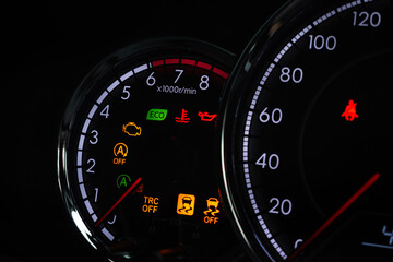 Fototapeta premium Close-up of modern car dashboard displaying multiple warning lights and indicators