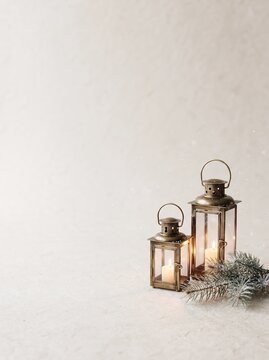 Scandinavian Minimal Christmas Background with Cozy Winter Lantern, Pine Branches and Copy Space