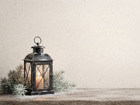 Scandinavian Minimal Christmas Background with Cozy Winter Lantern, Pine Branches and Copy Space