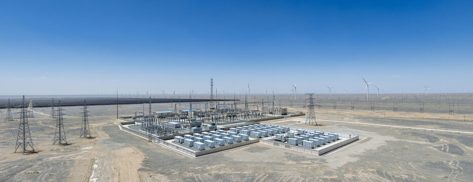 Aerial View of Energy Storage Station and Substation in Gobi Desert with Wind and Solar Farms