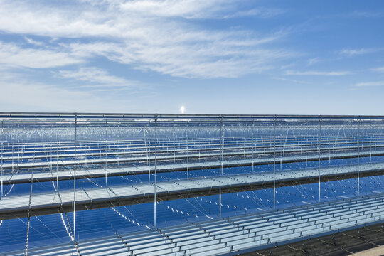 Close-Up of Linear Fresnel Reflector Concentrated Solar Power Station Structure with Glowing Molten Salt Tower
