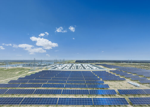 Aerial View of Vast Solar Farm and Energy Storage Power Station on Arid Grassland