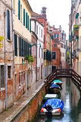 City of Venice, canal, bridge, gondola boats, alley and colorful local buildings and houses  © PaBou