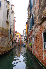 City of Venice, canal, bridge, gondola boats, alley and colorful local buildings and houses  © PaBou