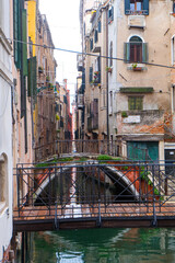 City of Venice, canal, bridge, gondola boats, alley and colorful local buildings and houses  © PaBou