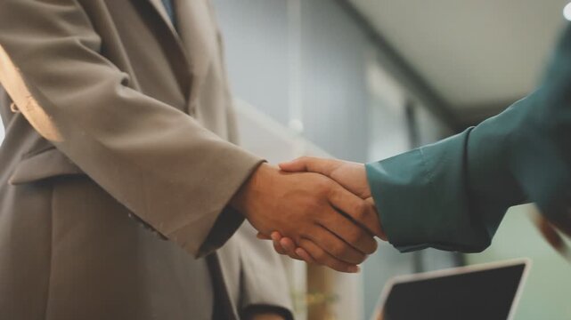 businessman handshake for teamwork of business merger and acquisition