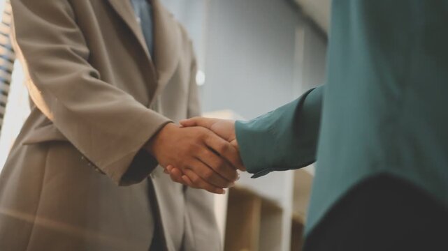 businessman handshake for teamwork of business merger and acquisition