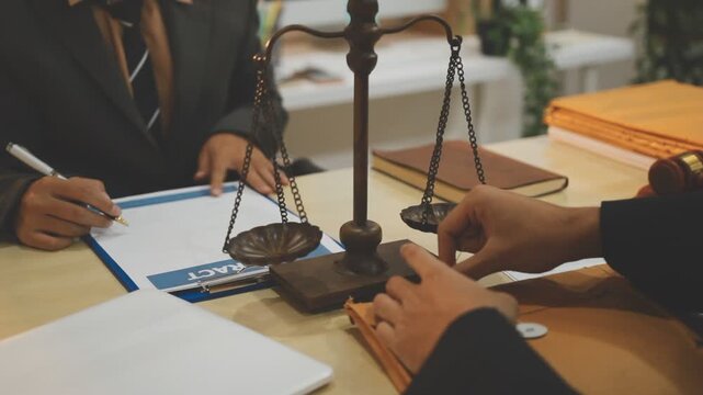 Lawyer explained to the client about the law that must be brought against the court case.