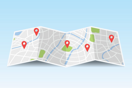 Folded paper city map with multiple red location pin markers, travel, navigation, and destination planning concept.