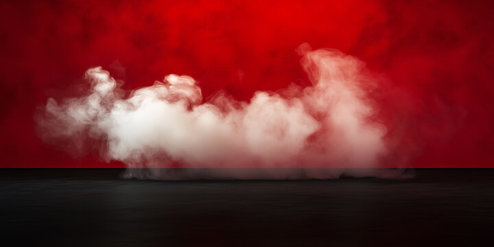 Thick white smoke cloud drifts horizontally above a dark reflective surface against a vibrant deep red illuminated background creating a dramatic stage atmosphere