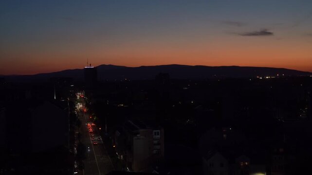 View of the evening in the city and traffic on the road