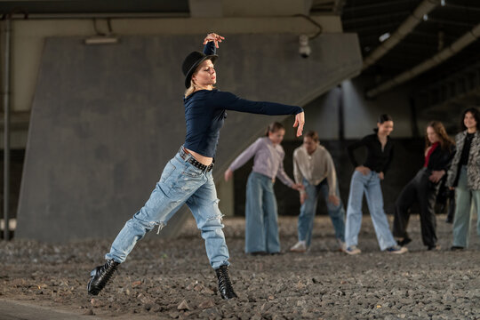Female street dancer strikes a pose during practice