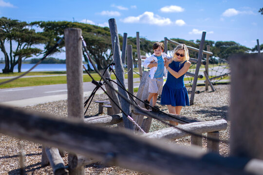A mother and son on a playground at Gulf State Park, Alabama.