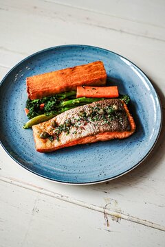 Gourmet salmon dinner with potatoes and broccolini