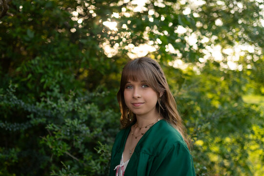 High school graduate poses for portraits outdoors