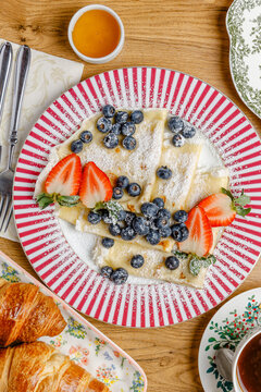 A composition of vintage plates featuring breakfast items