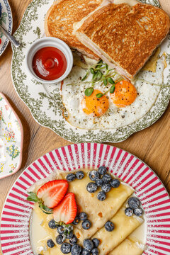 A composition of vintage plates featuring breakfast items