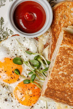 Texture fried egg breakfast with toast on a vintage plate.