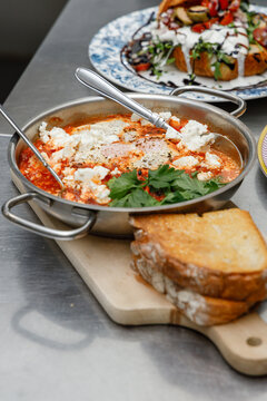 Shakshuka in a pan in a restaurant kitchen