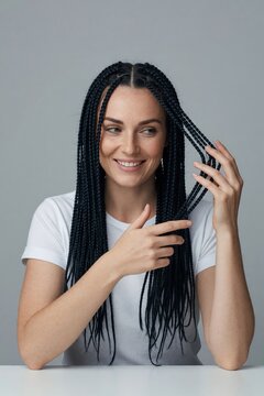 Natural black medium length loose box braids on woman portrait beauty