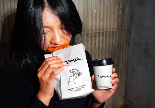 Holding Cup and Bakery Mockup