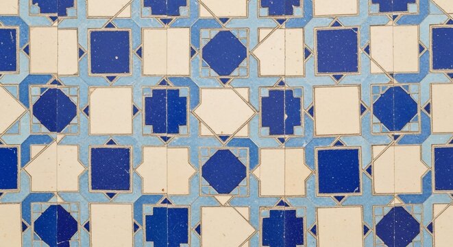 A mosaic of time-worn blue and cream tiles, a story whispered in geometric patterns.