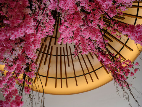 Decorative pink flowers hanging from the ceiling