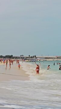 UAE, Dubai - United Arab Emirates 01 April 2024 Busy Beach Day at Jumeirah Beach Residence, Dubai. Crowded summer day at JBR Beach with people enjoying the sun, sea, and sand in Dubai.