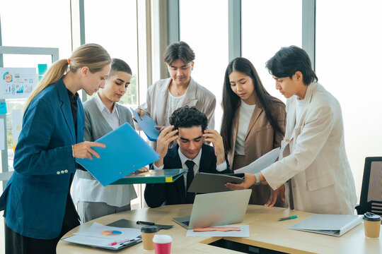 Stressed office manager handling multiple reports and urgent requests from colleagues at the same time. Business pressure, workplace burnout, deadline management, teamwork and corporate productivity.