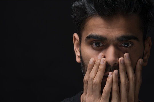 Closeup of a stressed man crying on the inside
