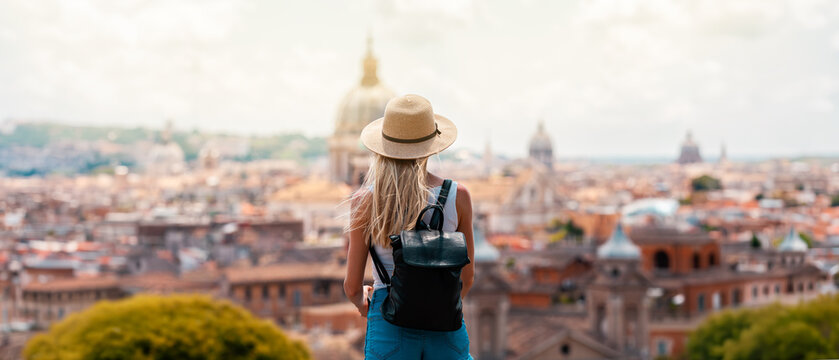 Young Female Tourist with Backpack and Smartphone Enjoying Panoramic View of Rome