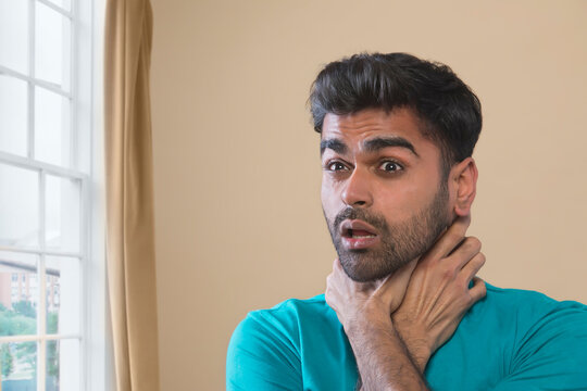 man suffocating from anxiety attack
