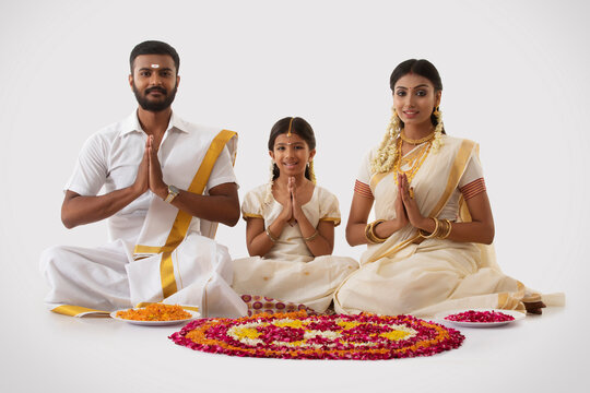 south indian family greeting with a smile on onam
