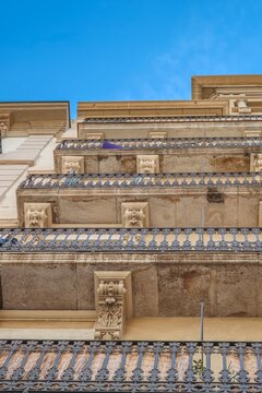 Wrought Iron Balconies and Stone Details of Traditional Building, Barcelona, Low Angle View of Classical Residential Facade