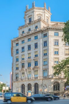 Historic Catalan Health Institute Building, Barcelona, Classical Facade, Eixample District, Motion Blur Taxi