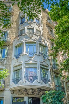 Modernism Architecture Facade with Curved Stone Bay Window in Barcelona, Modernisme Style