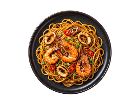 Stir-fried noodles with prawns, squid, and vegetables on a dark plate isolated element on transparent background.