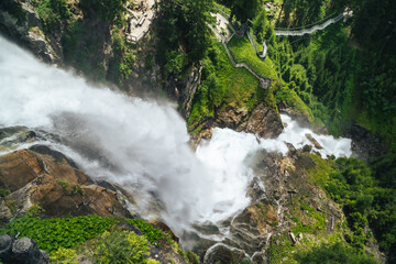 Powerful Alpine Waterfall Cascading Over Rocky Cliff in Austria © Török Balázs