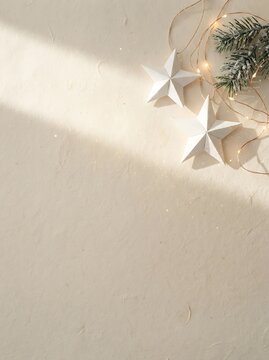 Scandinavian Minimal Christmas Background with Handmade Paper Stars, Pine Branches and Copy Space