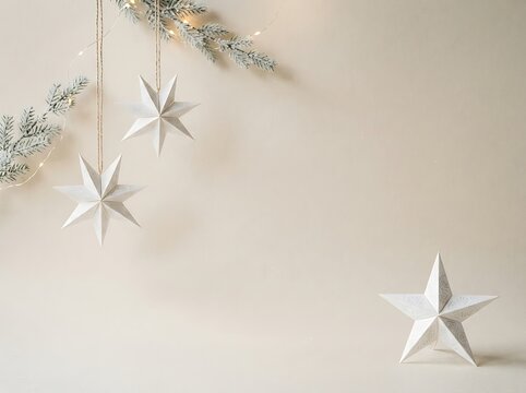 Scandinavian Minimal Christmas Background with Handmade Paper Stars, Pine Branches and Copy Space