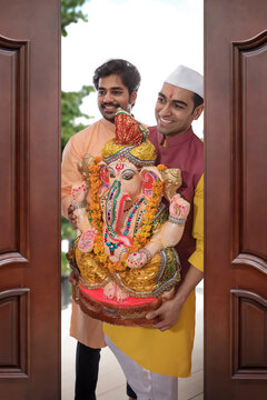 Men bringing Ganpati home on the occasion of Ganesh Chaturthi