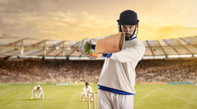 Batsman Hitting Ball During a Cricket Match In Stadium