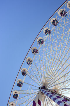 A dizzying ride and blue skies at a funfair