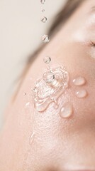 Fototapeta premium Close-Up of Water Droplets on Glowing Skin Highlighting Hydration and Freshness