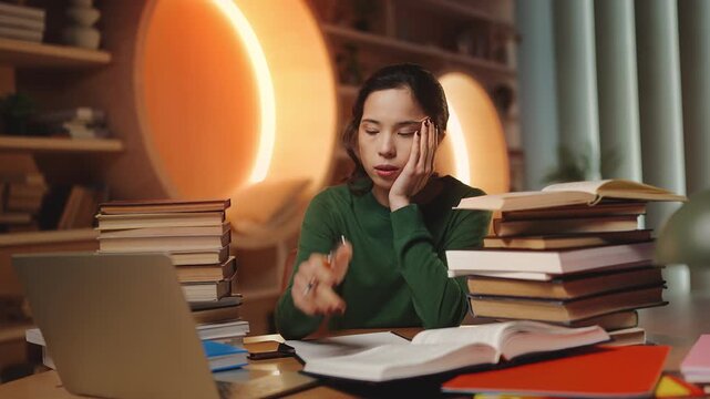 Portrait of young Korean female student suffering from study fatigue in library