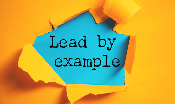Lead By Example is shown using the text
