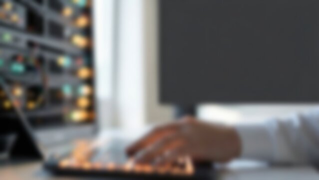 Software Developer Typing on Backlit Keyboard for Artificial