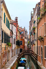 City of Venice, canal, bridge, gondola boats, alley and colorful local buildings and houses  © PaBou