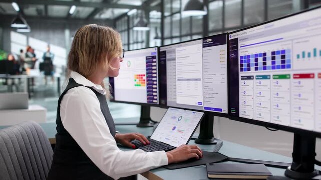 Compliance Manager Reviews Risk Matrix On Laptop